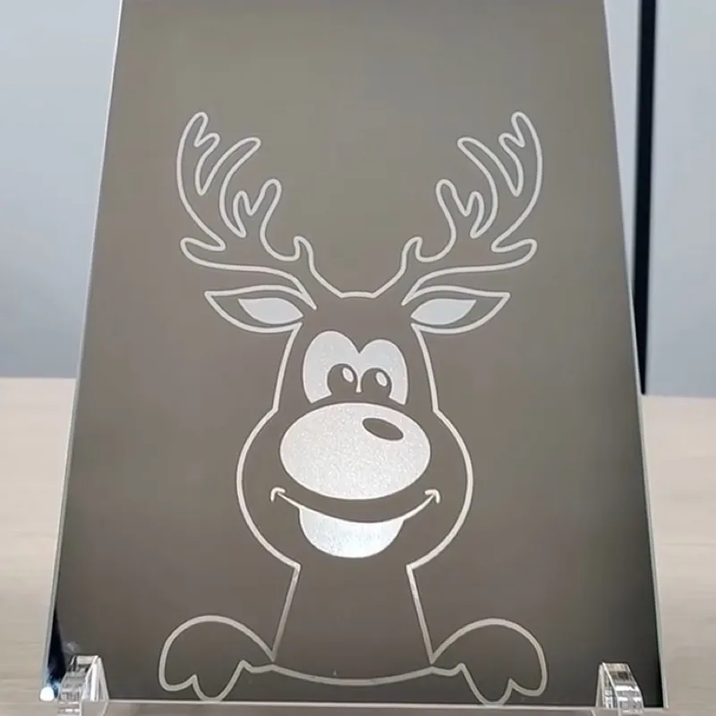 Rudolf the reindeer on mirror material, made with a CO₂ laser