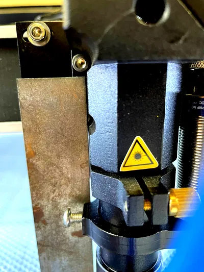 Right-angle square tool next to head close-up