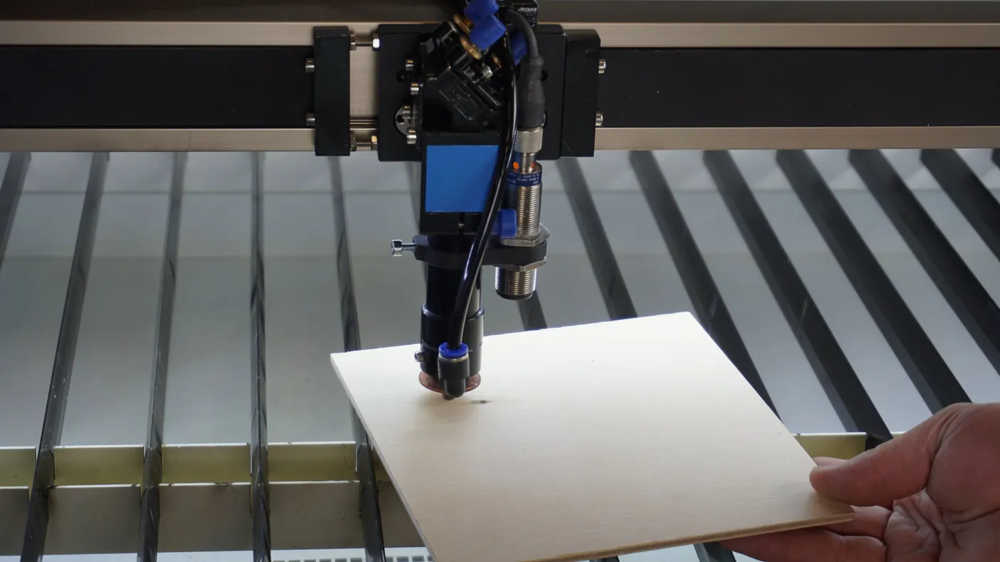 Holding a sheet of material under the autofocus sensor to see whether its light comes on
