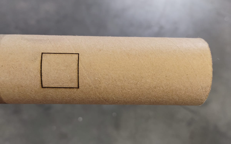 Example of a square cut in a cardboard roll